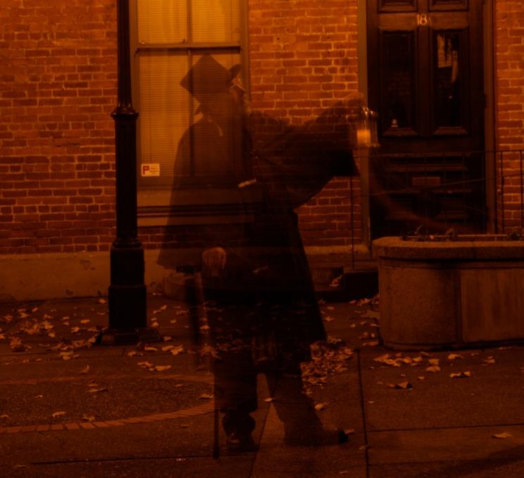 A Ghostly Walks guide appears as an apparition in Bastion Square in Victoria, BC