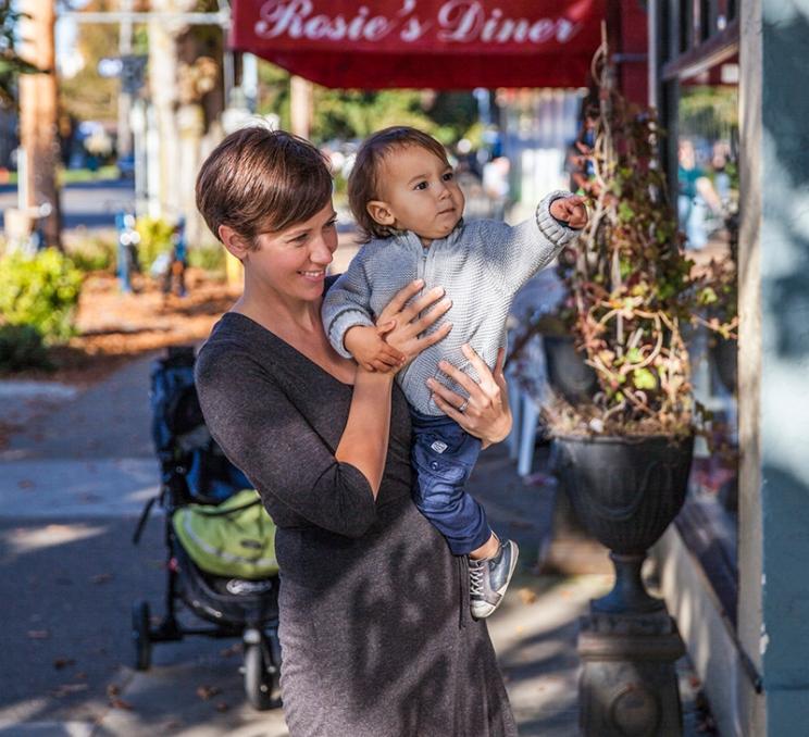 A mother and child explore Cook Street in Victoria, BC
