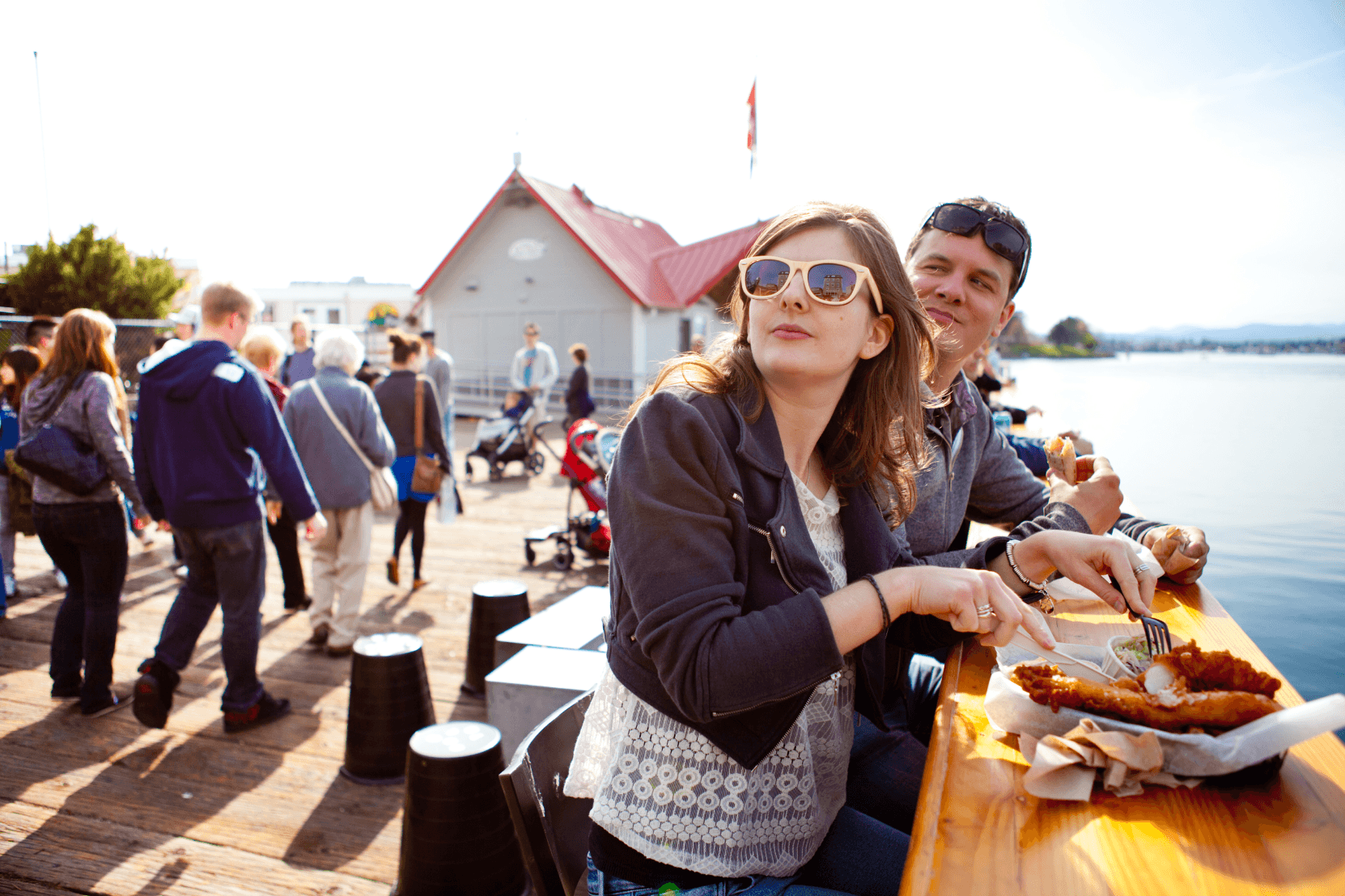 A couple eating fish & chips in Victoria, BC