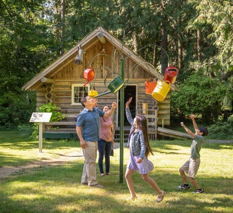 A family explores the grounds of Heritage Acres in Victoria, BC