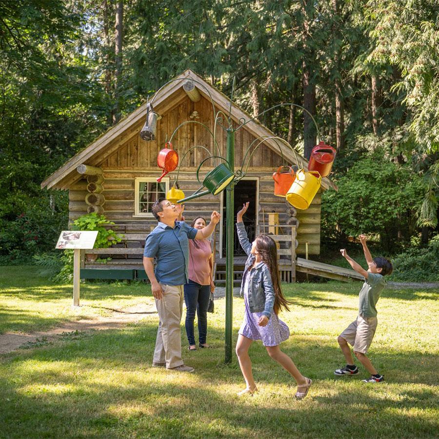 A family explores the grounds of Heritage Acres in Victoria, BC