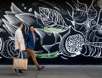 a young couple shopping in cook street village