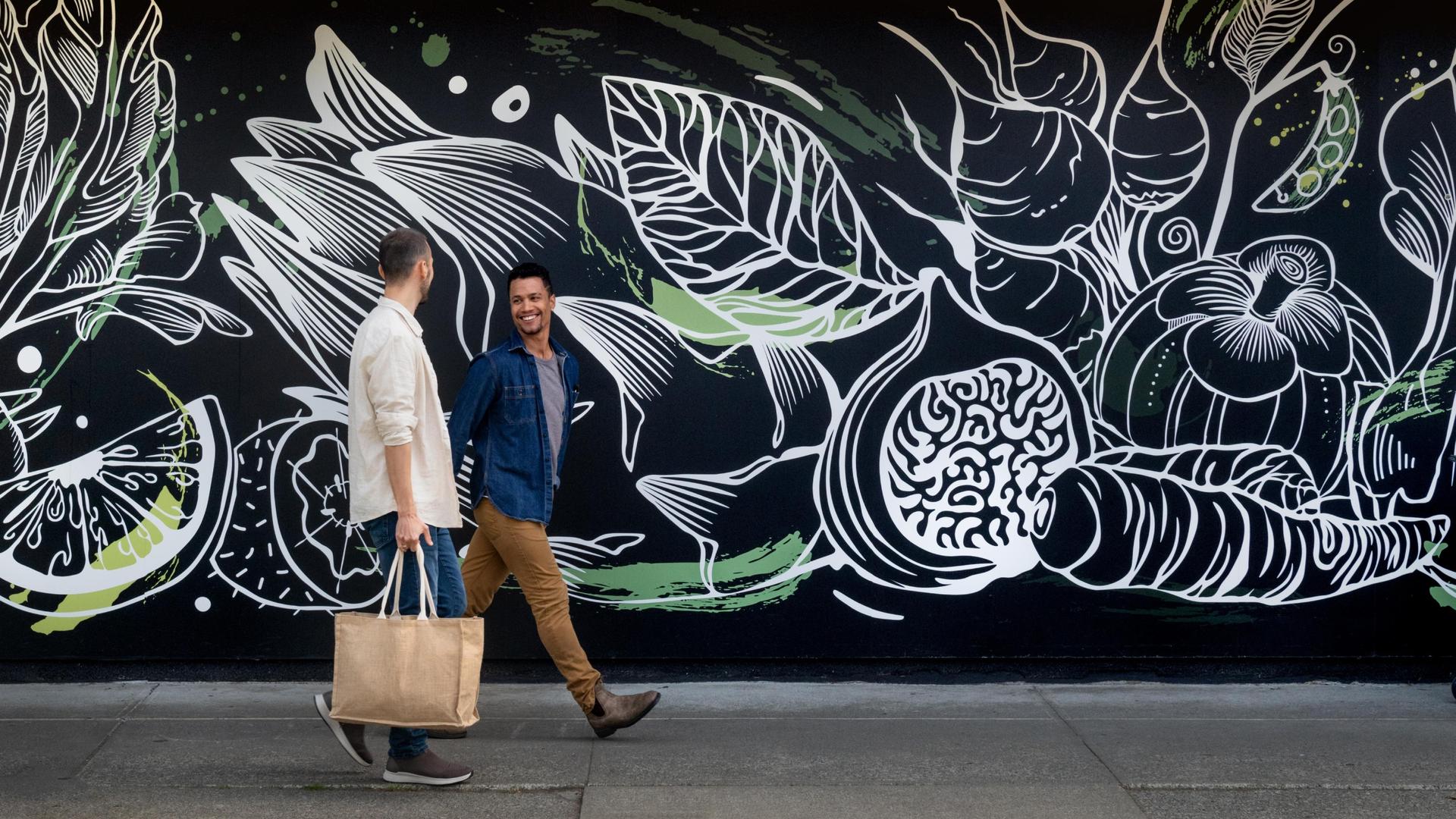 a young couple shopping in cook street village