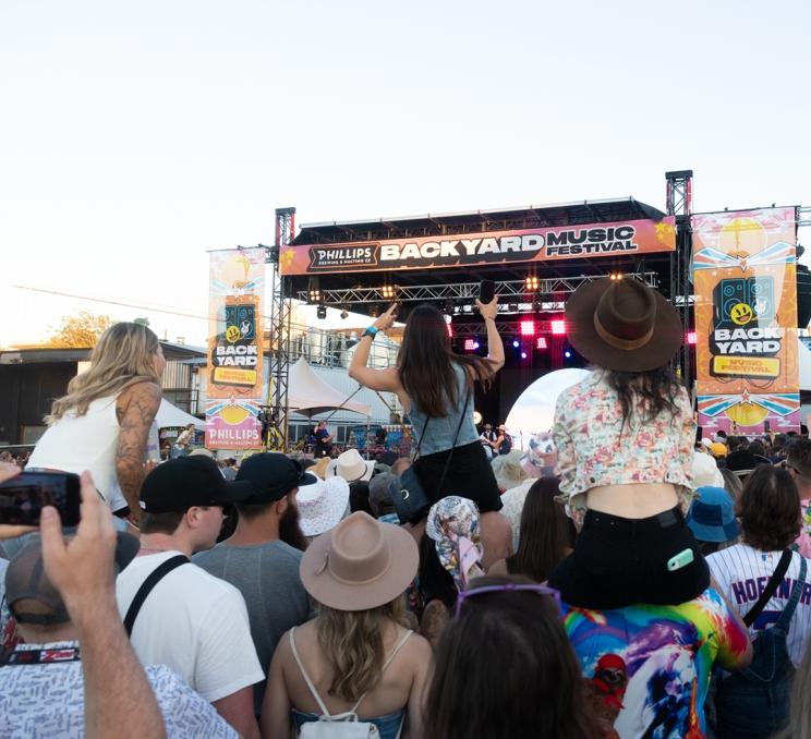A crowd watches on during a performance at the Tilt Phillips Backyard Weekend music festival in Victoria, BC