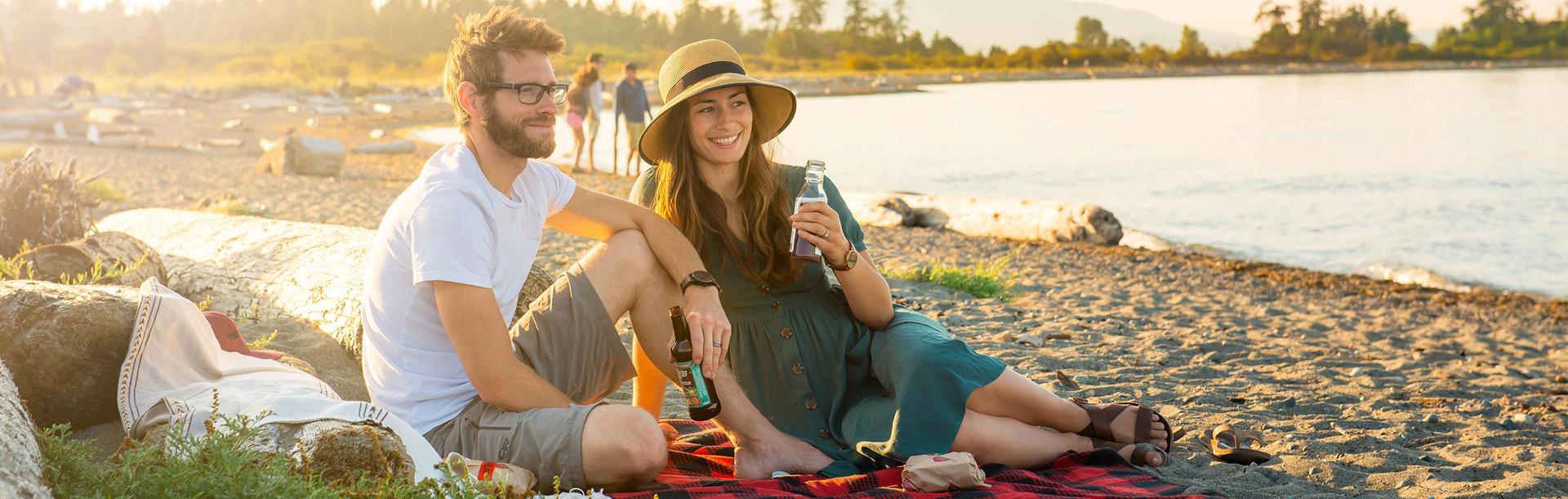 A couple has a picnic on the beach in Greater Victoria, BC