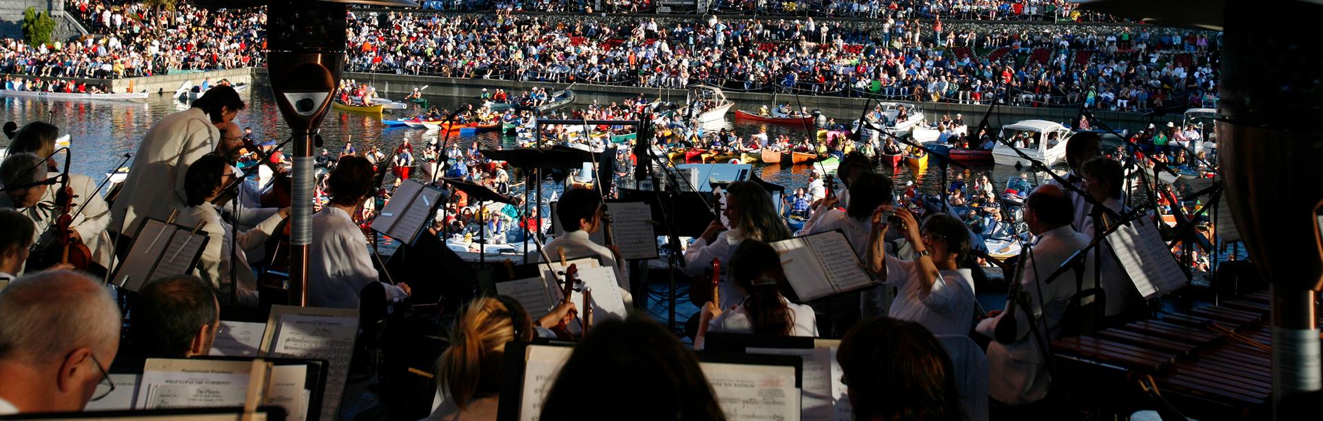Musicians from the Victoria Symphony perform on a floating barge in the Inner Harbour at Symphony Splash! in Victoria, BC