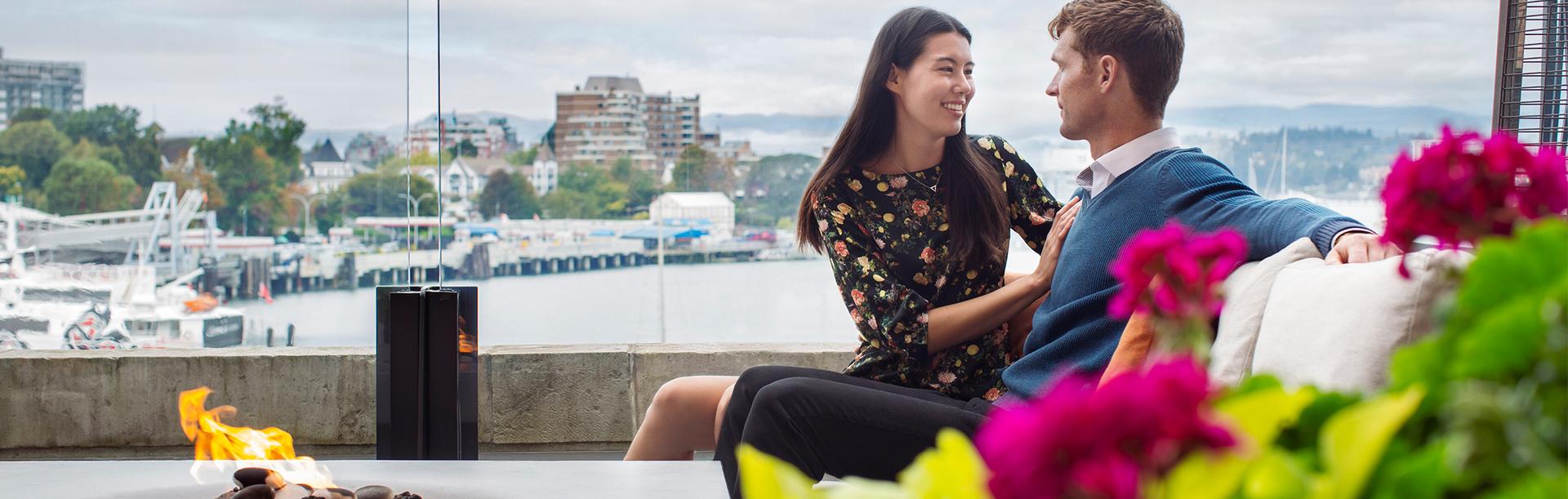 A couple has a romantic date on the Veranda at the Fairmont Empress hotel in Victoria, BC