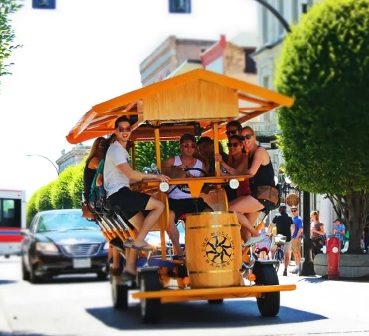 A tour with The Rolling Barrel heads down Government Street in Victoria, BC