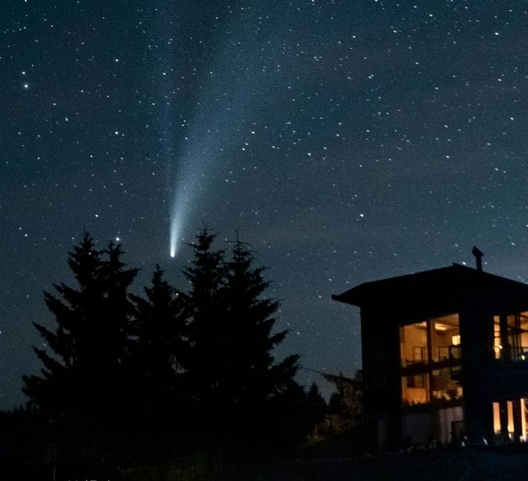 A comet soars through the sky above Gordon's Beach in Greater Victoria, BC