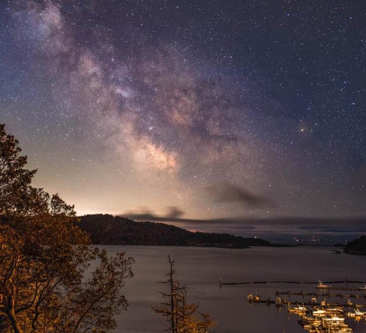 The milky way in the sky above Spirit Bay in Greater Victoria, BC