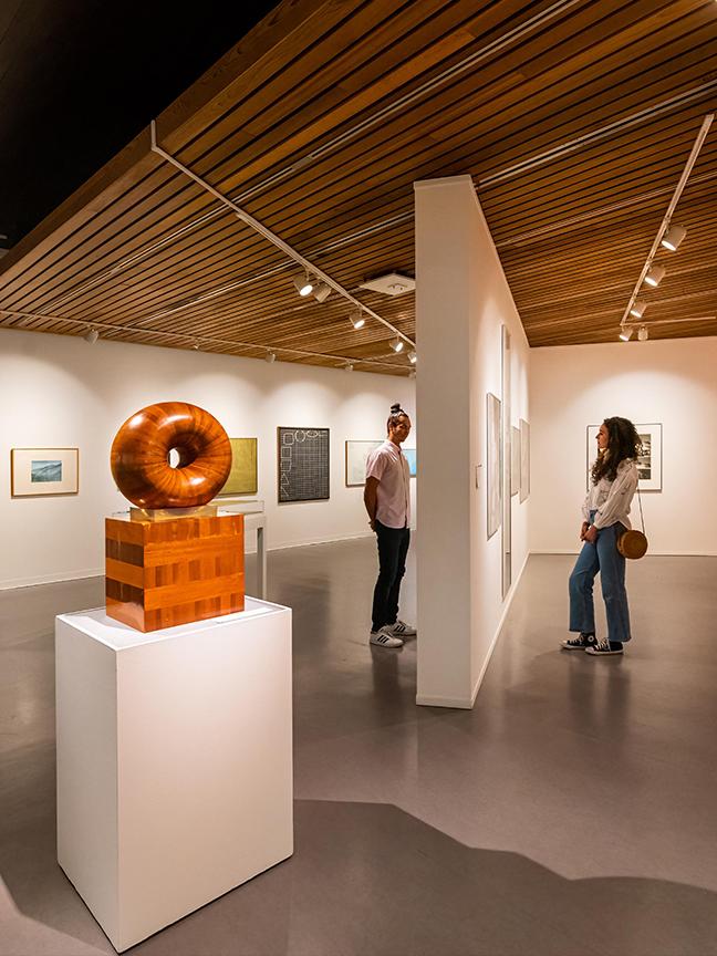 A couple examines artwork in the Art Gallery of Greater Victoria in Victoria, BC