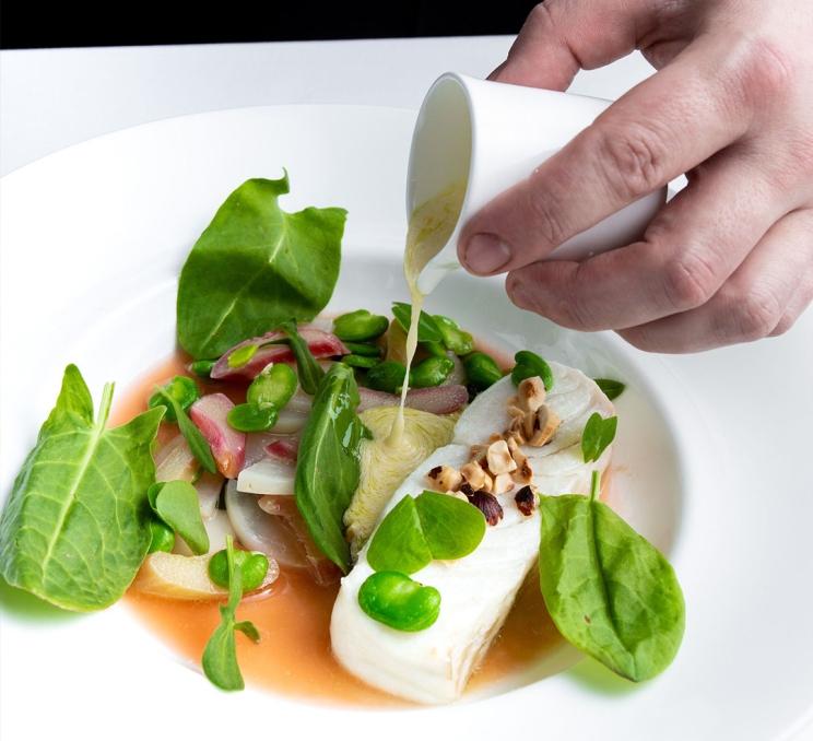 A dish is artfully plated at The Courtney Room in Victoria, BC