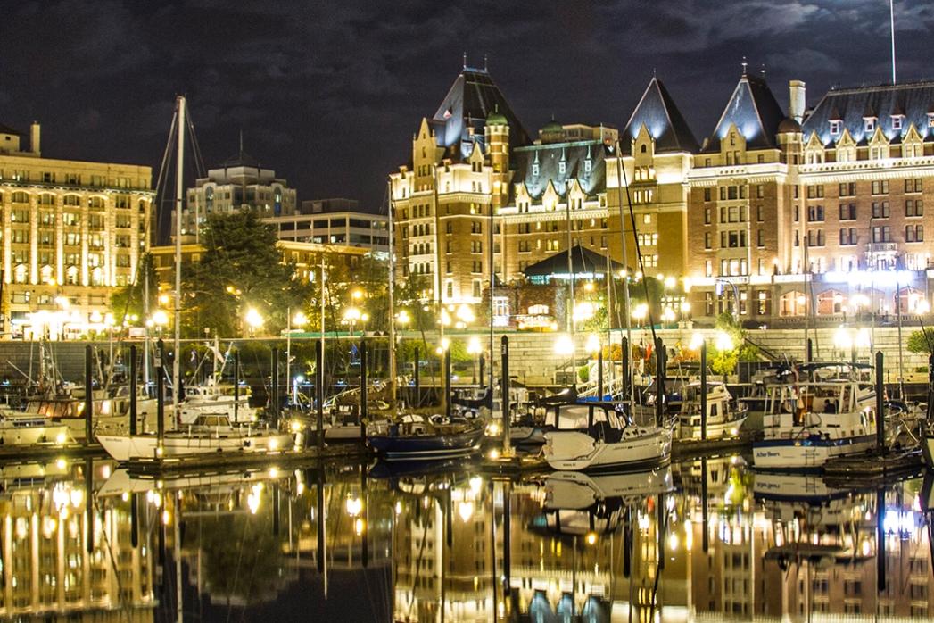 The harbourfront of Victoria, BC illuminated at night