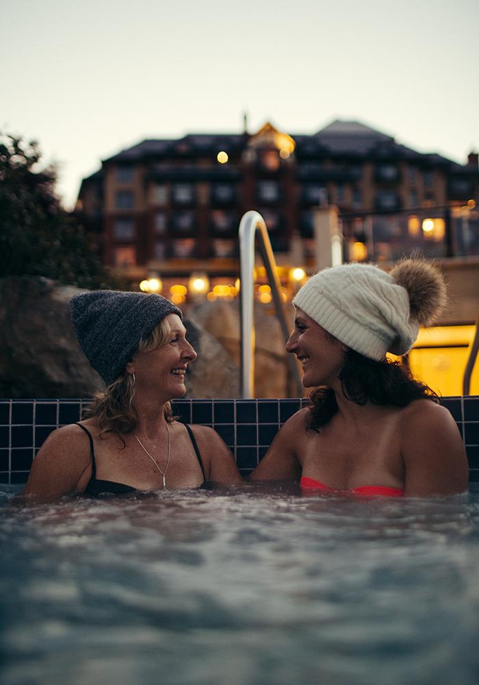 A couple soaks in the hot tub at the Oak Bay Beach Hotel in Victoria, BC