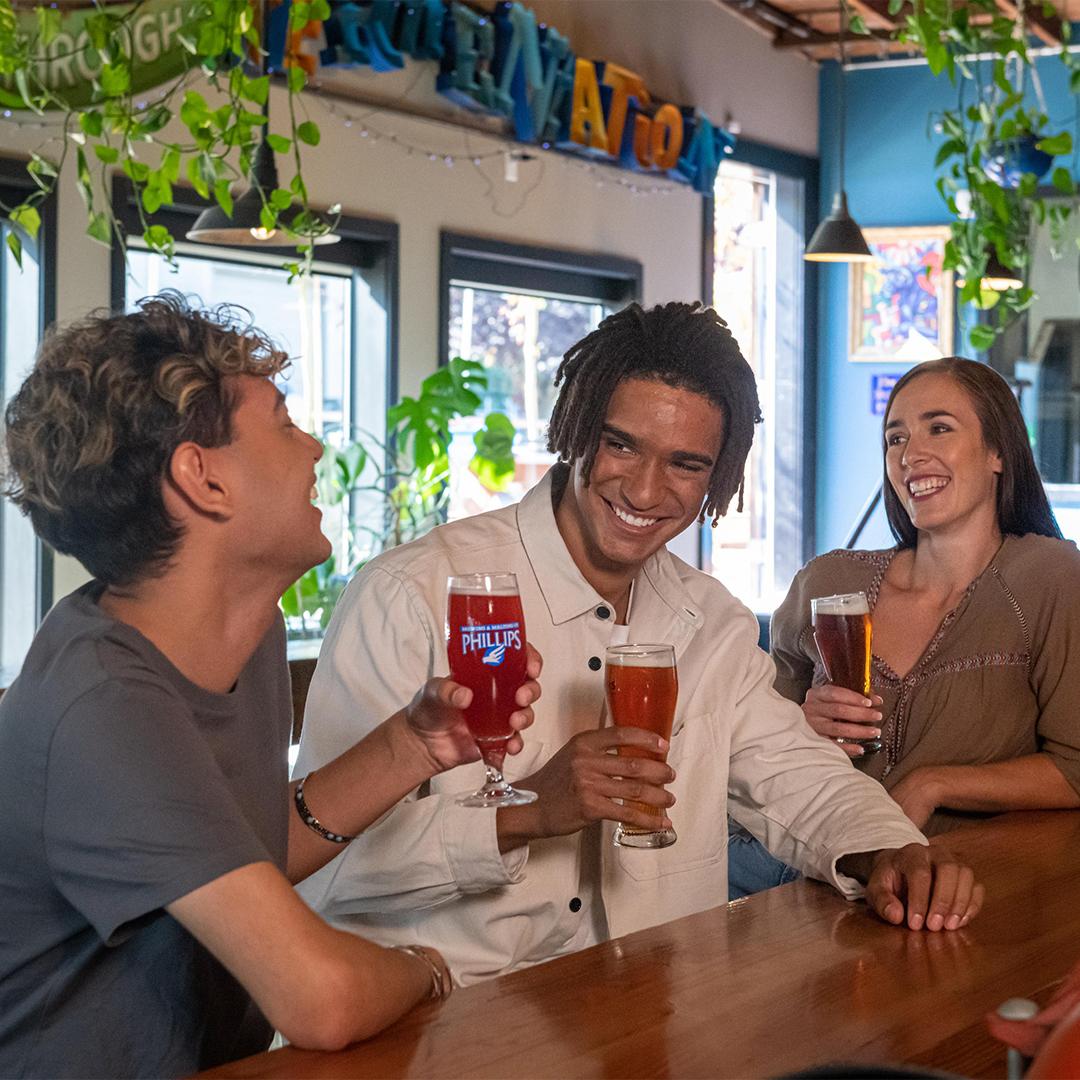 A group of friends enjoy a pint at Phillips Brewing & Malting in Victoria, BC