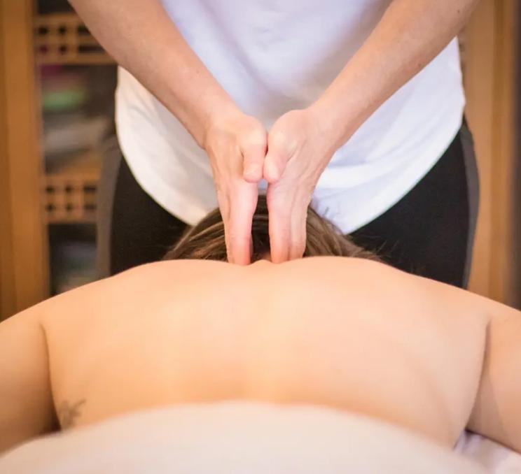 A person gets a massage from Compass Mobile Therapeutics in Victoria, BC
