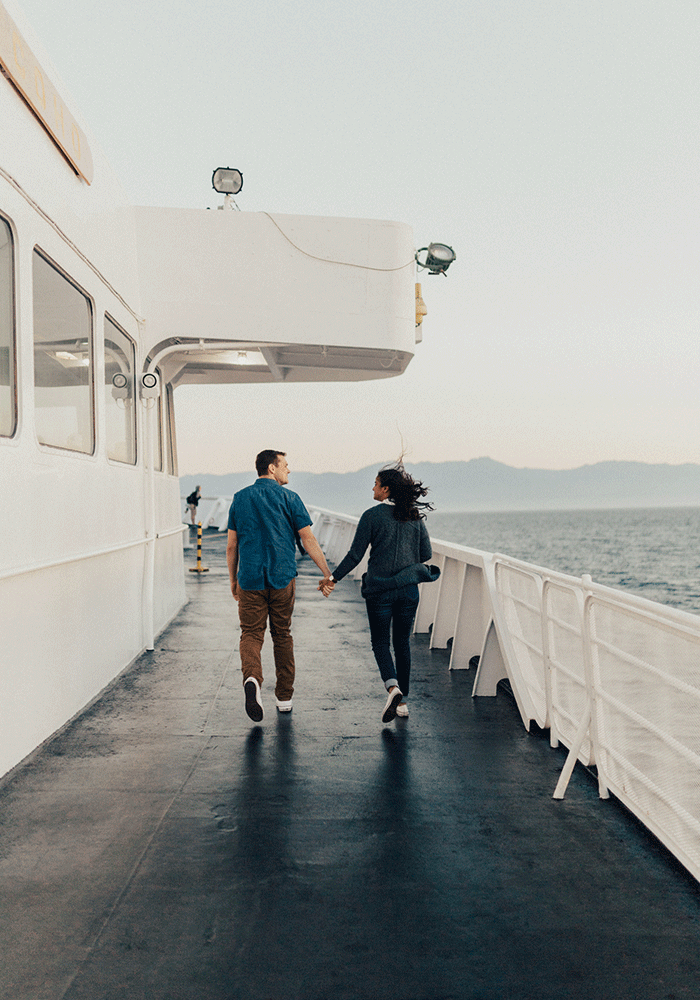 A couple walks hand-in-hand along the deck of the MV Coho from Black Ball Ferry Lines while sailing to Victoria, BC