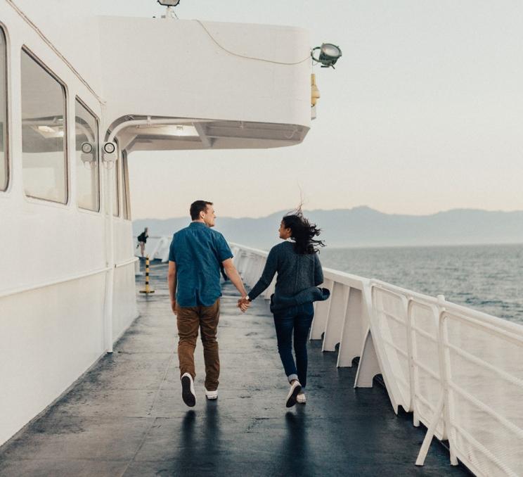 A couple walks hand-in-hand along the deck of the Black Ball Ferry Line's Coho ferry enroute to Victoria, BC