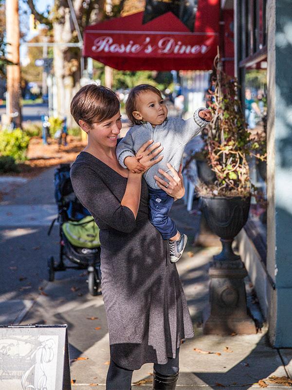 A woman and her baby explore Cook Street Village in Victoria, BC's Fairfield neighbourhood