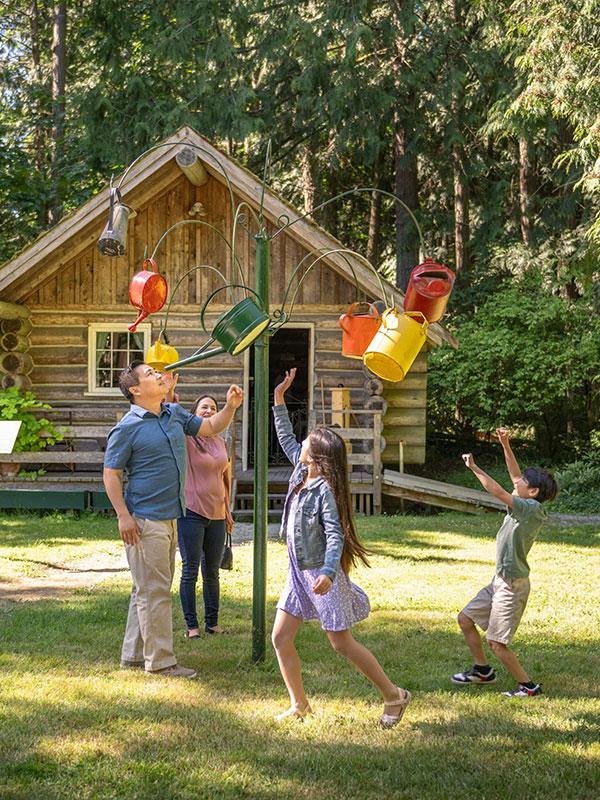 A young family looks at some artwork at Heritage Acres in Victoria, BC