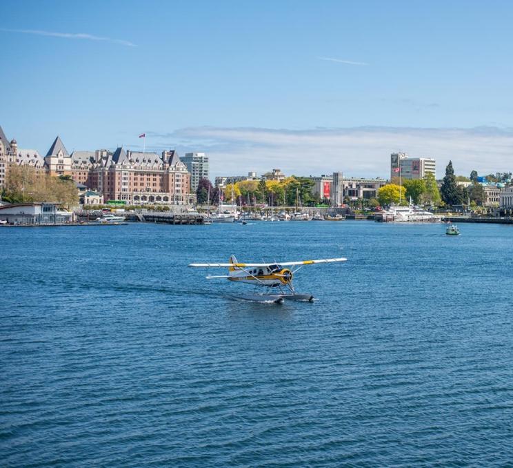 A Kenmore Air Seaplane takes off from Victoria BC's Inner Harbour