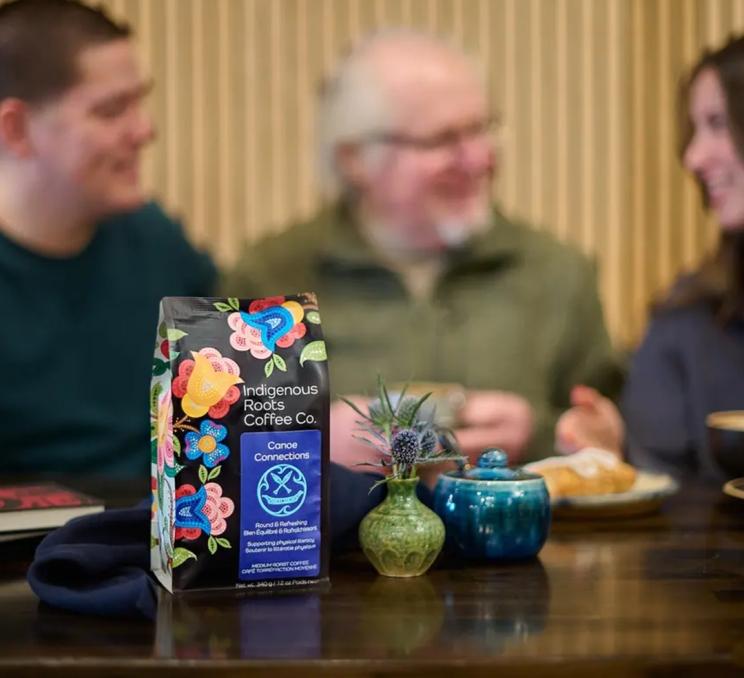 A packet of Indigenous Roots Coffee Company's coffee on a table
