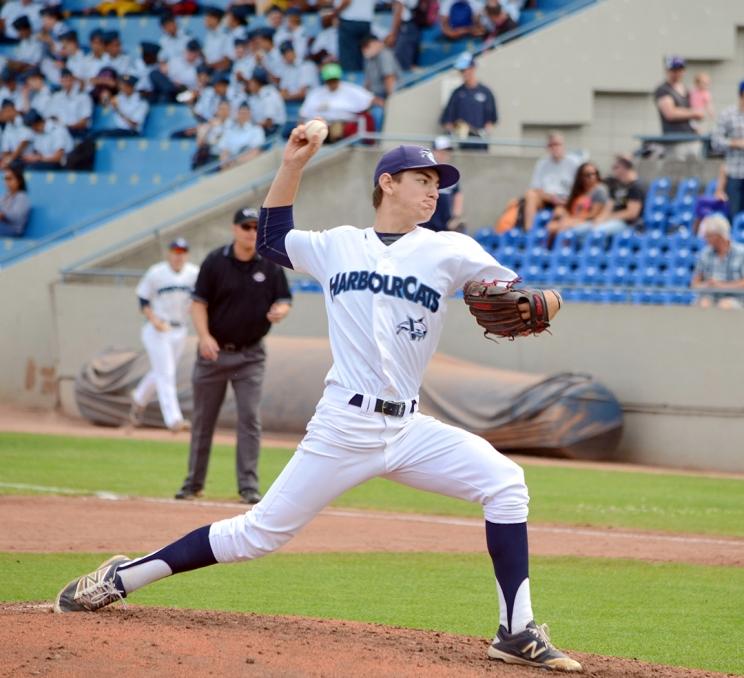 A Victoria HarbourCats pitcher mid-throw during a baseball game in Victoria, BC