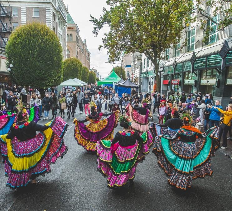 Dancers perform on Government Street during Wicked Victoria in Victoria, BC