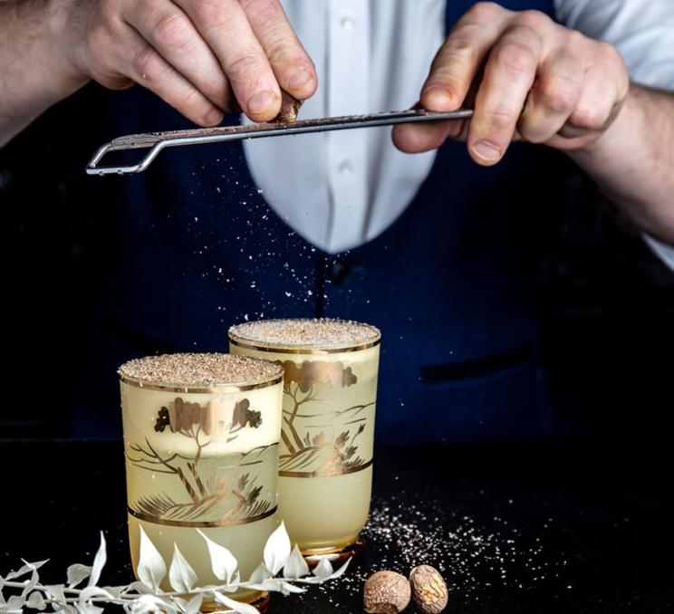 A bartender prepares cocktails at the Courtney Room in Victoria, BC
