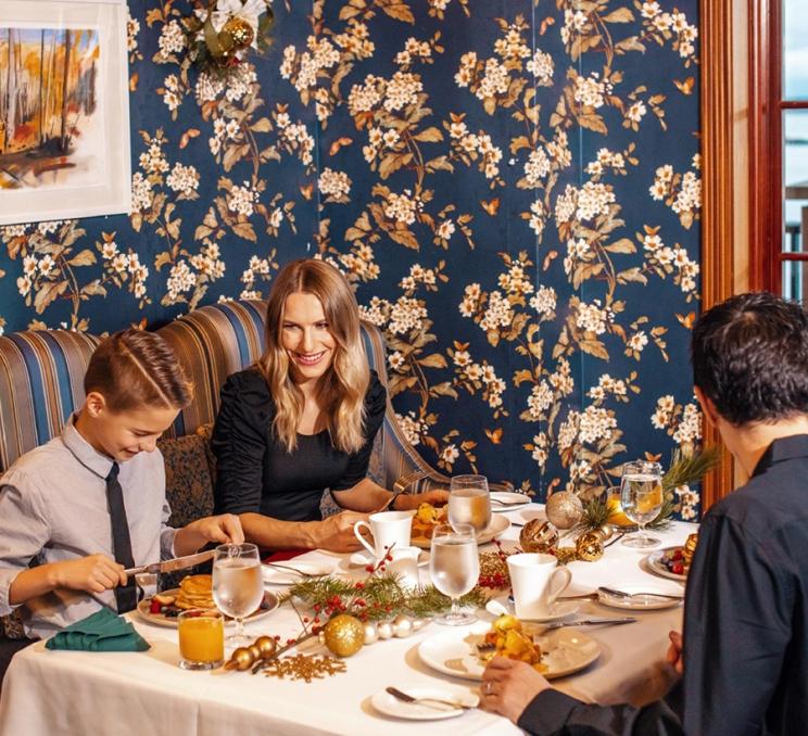 A family enjoys Christmas Brunch at The Dining Room in the Oak Bay Beach Hotel in the Oak Bay neighbourhood of Victoria, BC