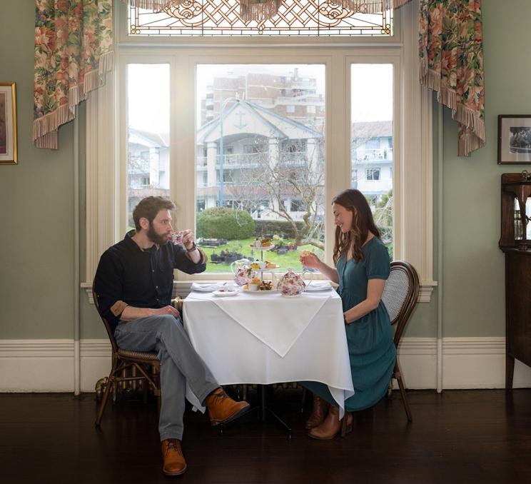 A couple enjoys Afternoon Tea at the Pendray Inn and Teahouse in Victoria, BC