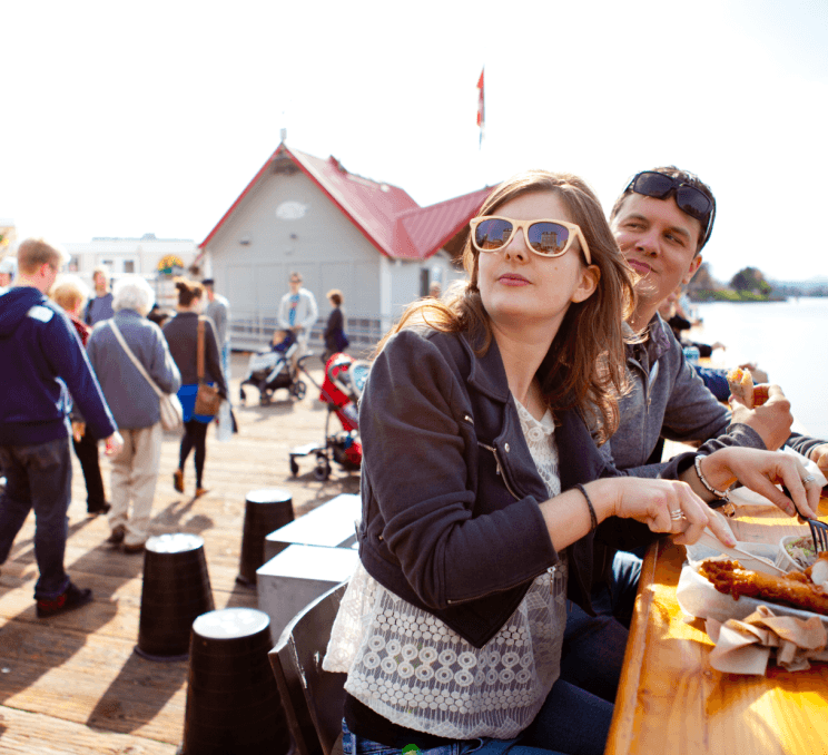 A couple eating fish & chips in Victoria, BC