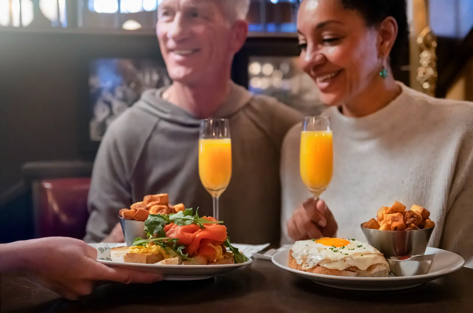 A couple enjoying brunch at Bard & Banker