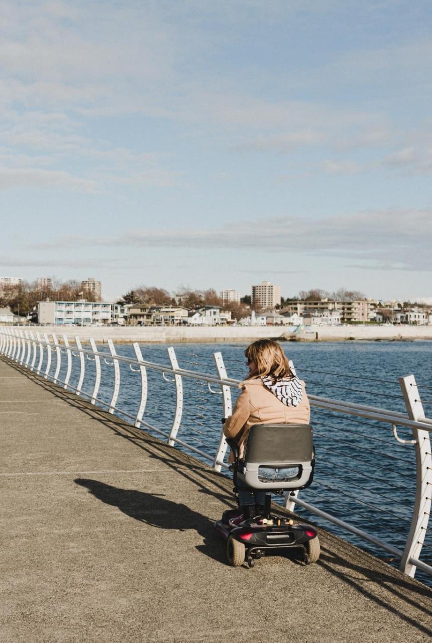 A person in a wheelchair on the Ogden Point Breakwater