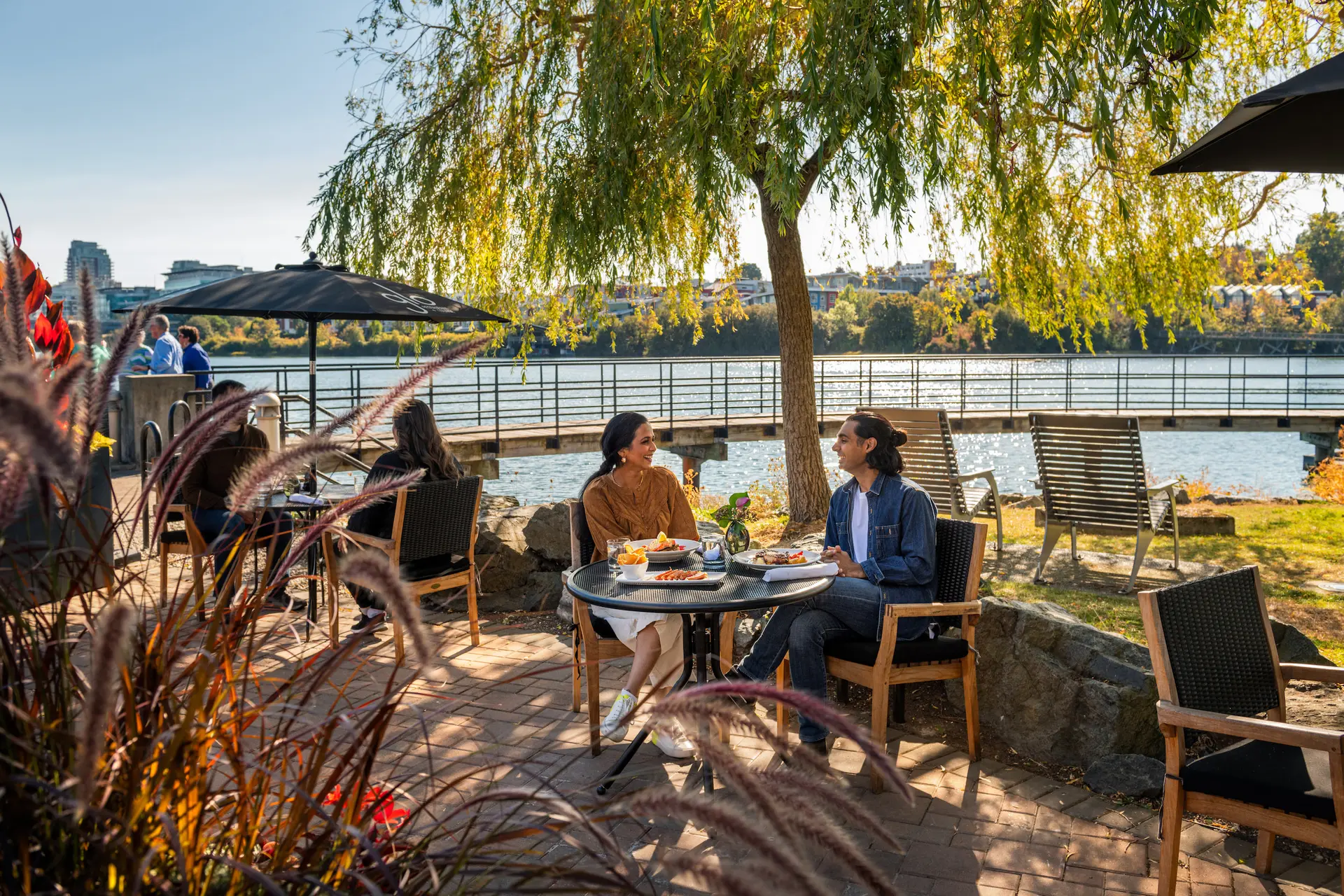 A couple dining on a patio in Victoria, BC