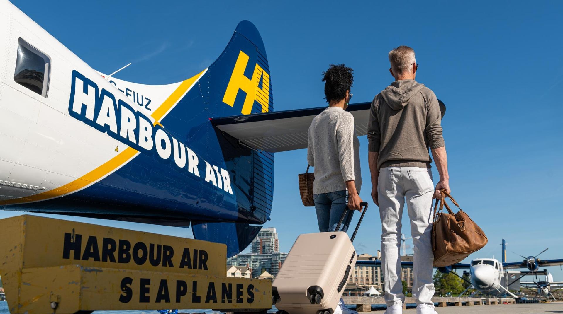 A couple leaving a Harbour Seaplane in Victoria, BC