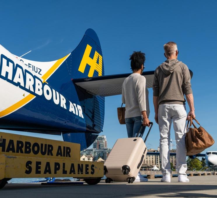 A couple leaving a Harbour Seaplane in Victoria, BC