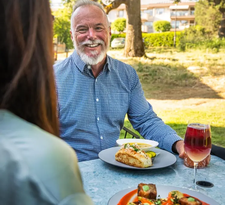 A person eating at Fireside Grill in Saanich, BC