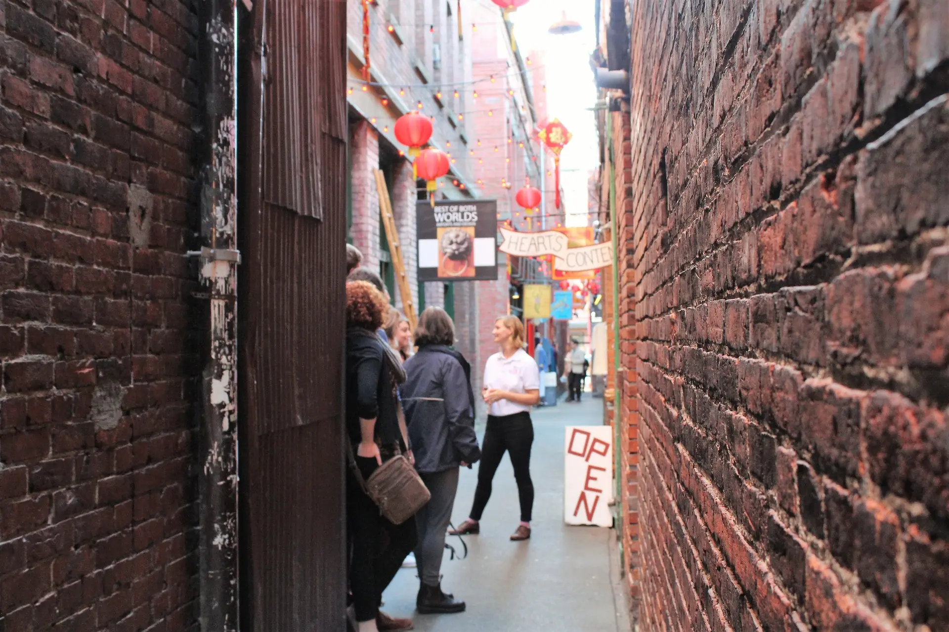 A couple on a food tour in Victoria, BC in an alley