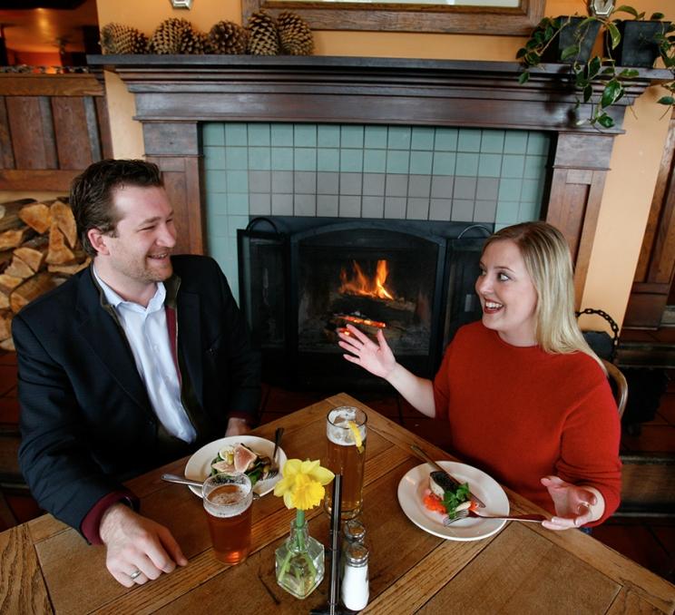 A couple dines at Spinnakers Gastro Brewpub in Victoria, BC