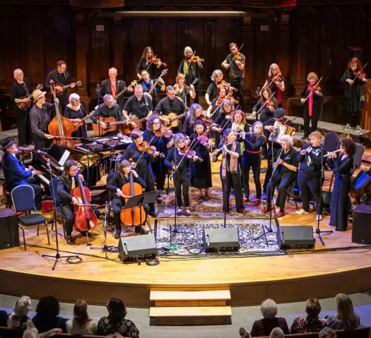 A band performs live music during Daniel Lapp's Joy of Life Concert in Victoria, BC