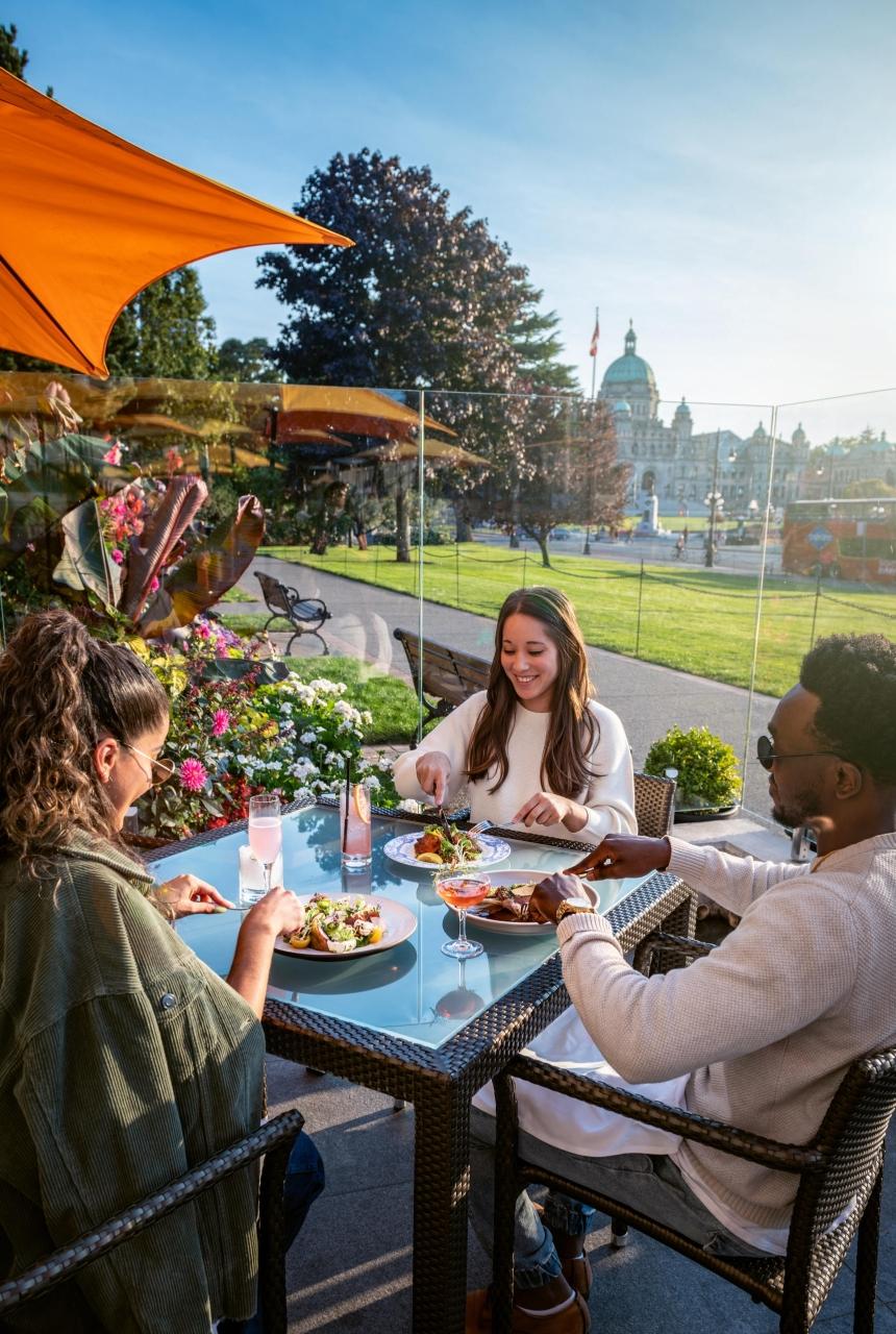 A group of friends dine on the Empress Veranda
