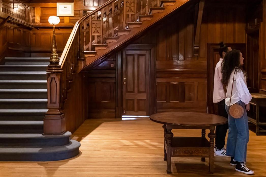 A couple examines artwork in the heritage home wing of the Art Gallery of Greater Victoria in Victoria, BC