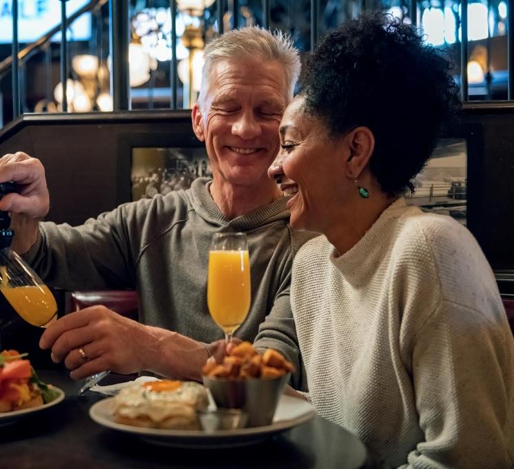 A couple enjoys brunch at the Bard & Banker in Victoria, BC