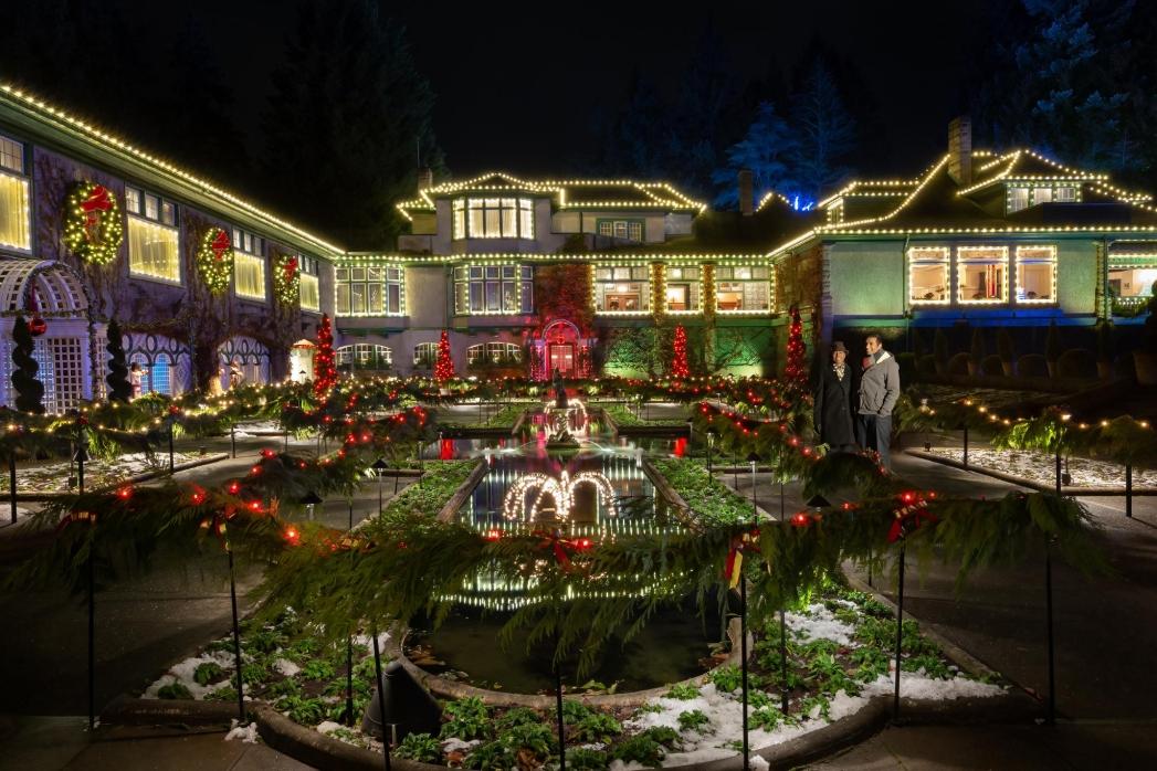 A couple explores the light display at The Butchart Gardens in Victoria, BC