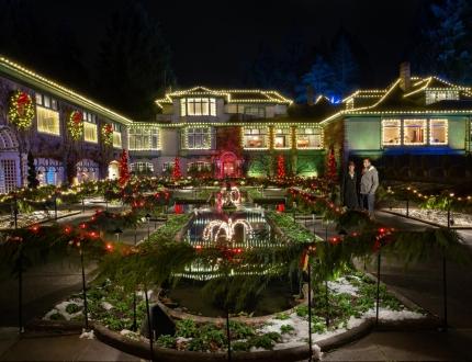 A couple explores the light display at The Butchart Gardens in Victoria, BC