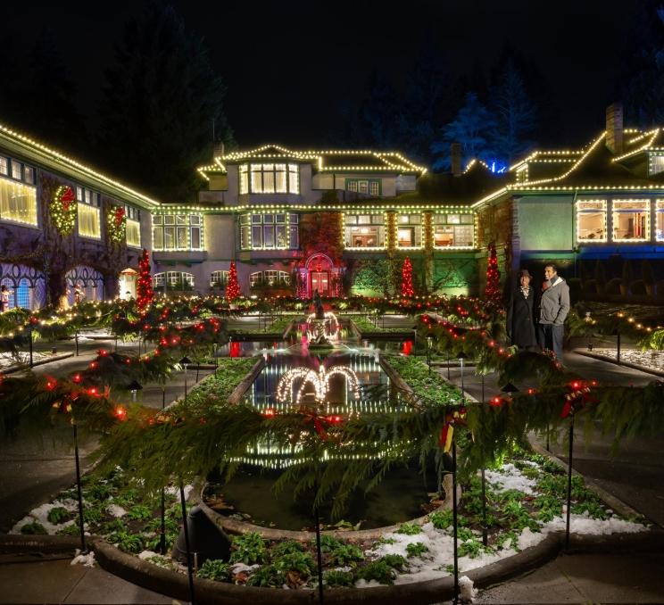 A couple explores the light display at The Butchart Gardens in Victoria, BC