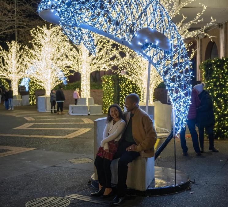 A father and daughter enjoy Lights of Wonder in Victoria, BC