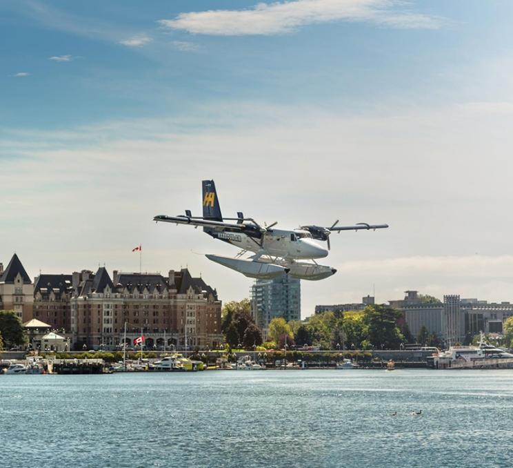 A Harbour Air Seaplanes lands in Victoria BC's Inner Harbour