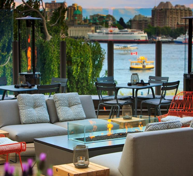 The patio at LURE Restaurant & Bar overlooking the Inner Harbour in Victoria, BC